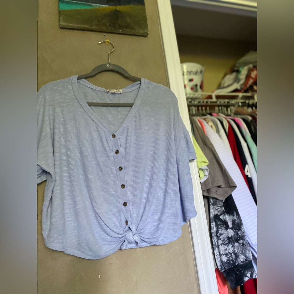 periwinkle loose buttoned shirt, with tied knot at bottom